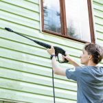 a-young-man-washes-the-facade-of-a-country-house-w-2025-03-08-21-38-31-utc
