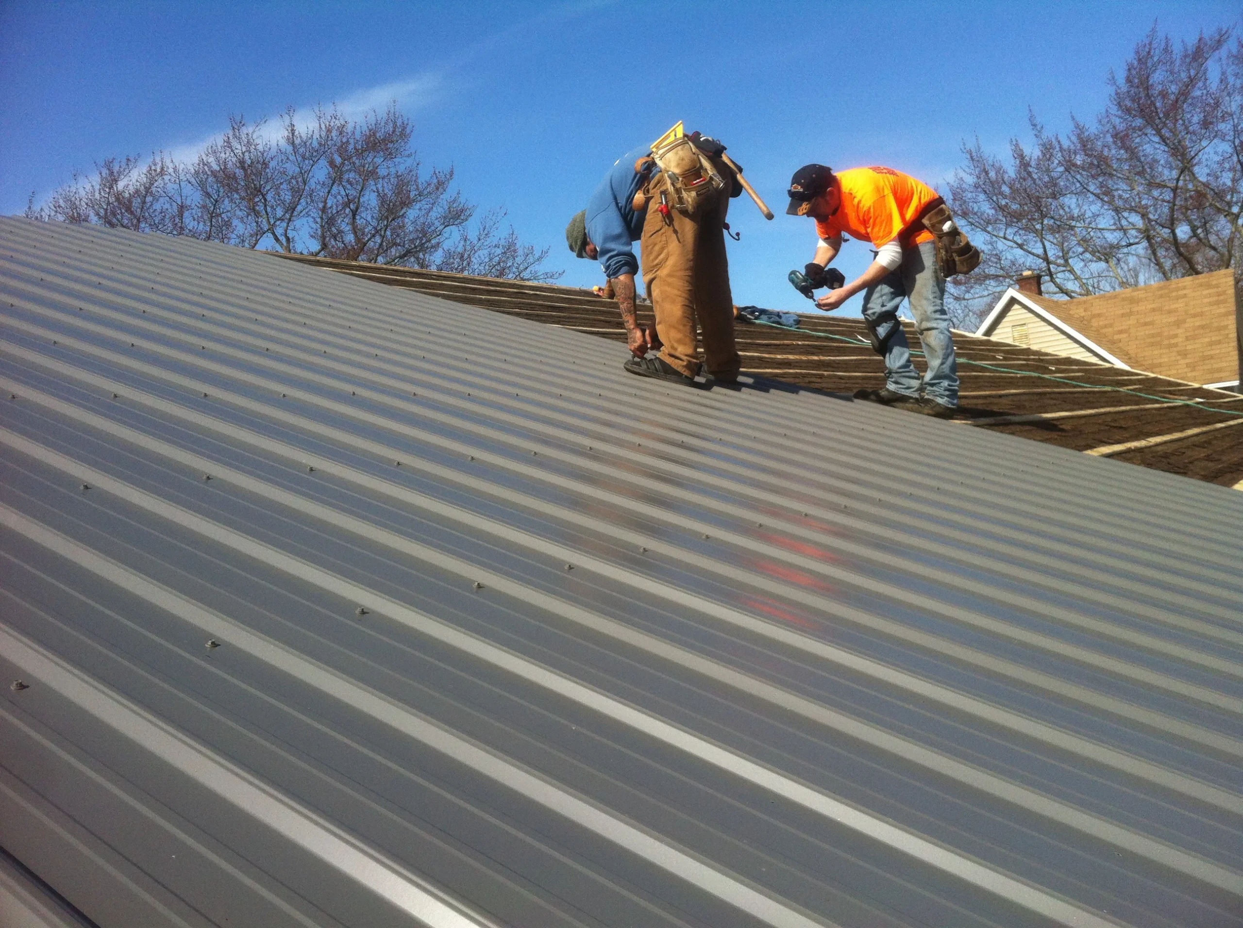 asphalt shingle, metal, and tile roofing options near me compared on countertop