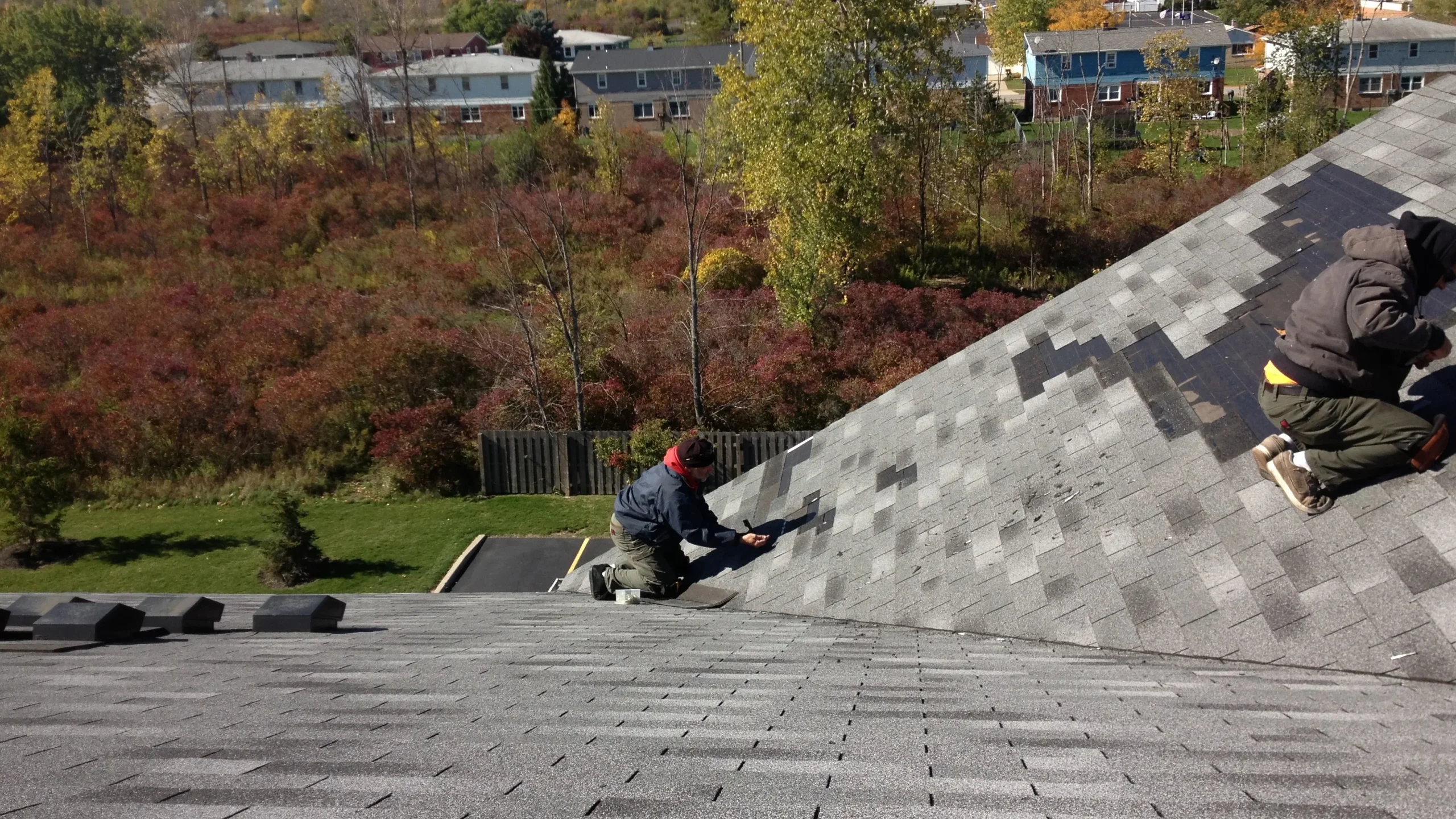 happy homeowner roof repair near me certified roofing professional thumbs up fixed roof