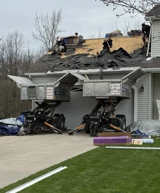 Roofers installing architectural shingles on a Niagara Falls NY home - roof replacement process niagara falls ny