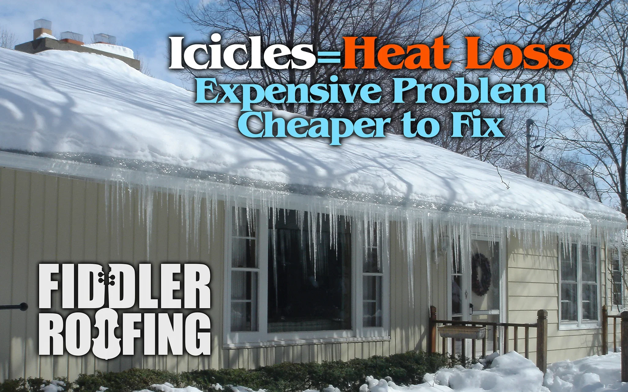 Large icicles on house gutter indicating heat loss and potential property damage.