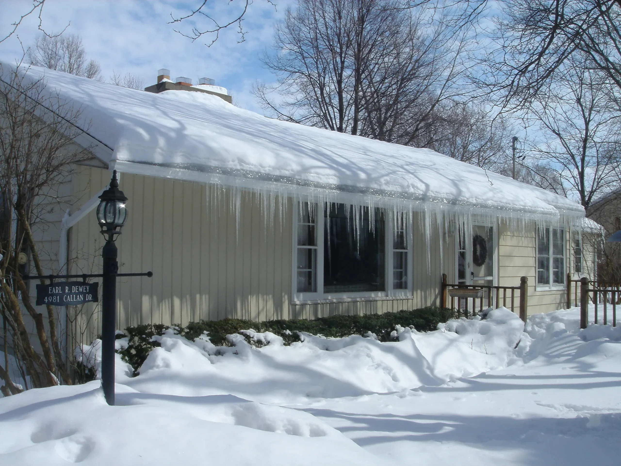 Ice dams on Niagara Falls home eaves—warranty at risk, homeowner concerned by costly water damage signs in winter
